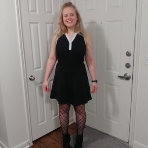 Black and white tennis-like blouse.